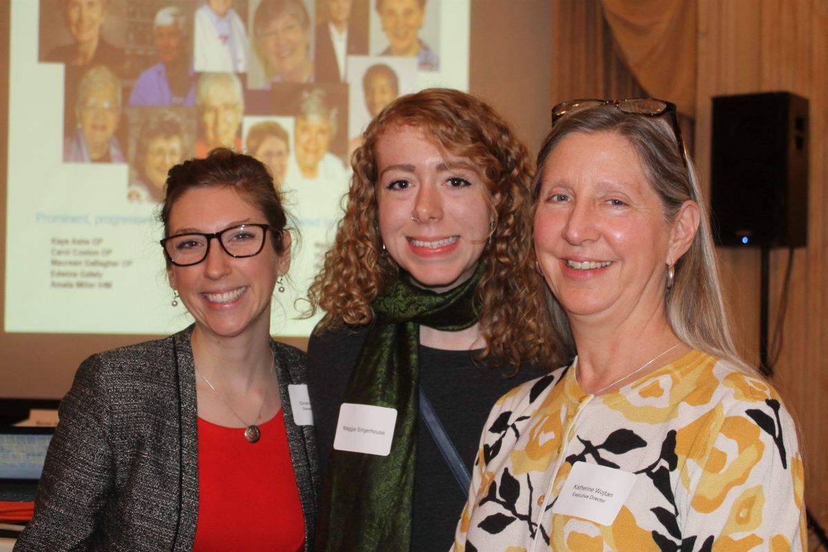 Photograph of hree women with arms around each other at the 30th anniversary of Mary's Pence event.