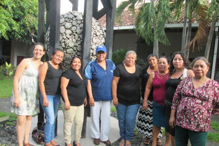 Photograph of ESPERA women standing outside with ESPERA staff.