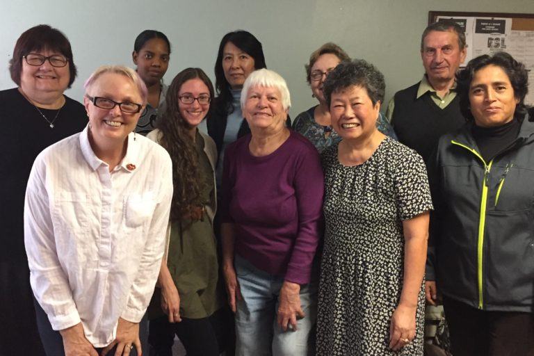 Photograph of the adult immigrant students in the Welcoming the stranger English Class.