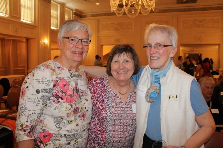 Three Mary's Pence donors smiling at an event.