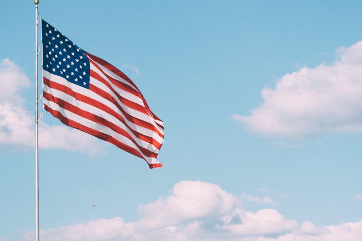 American flag against blue sky.