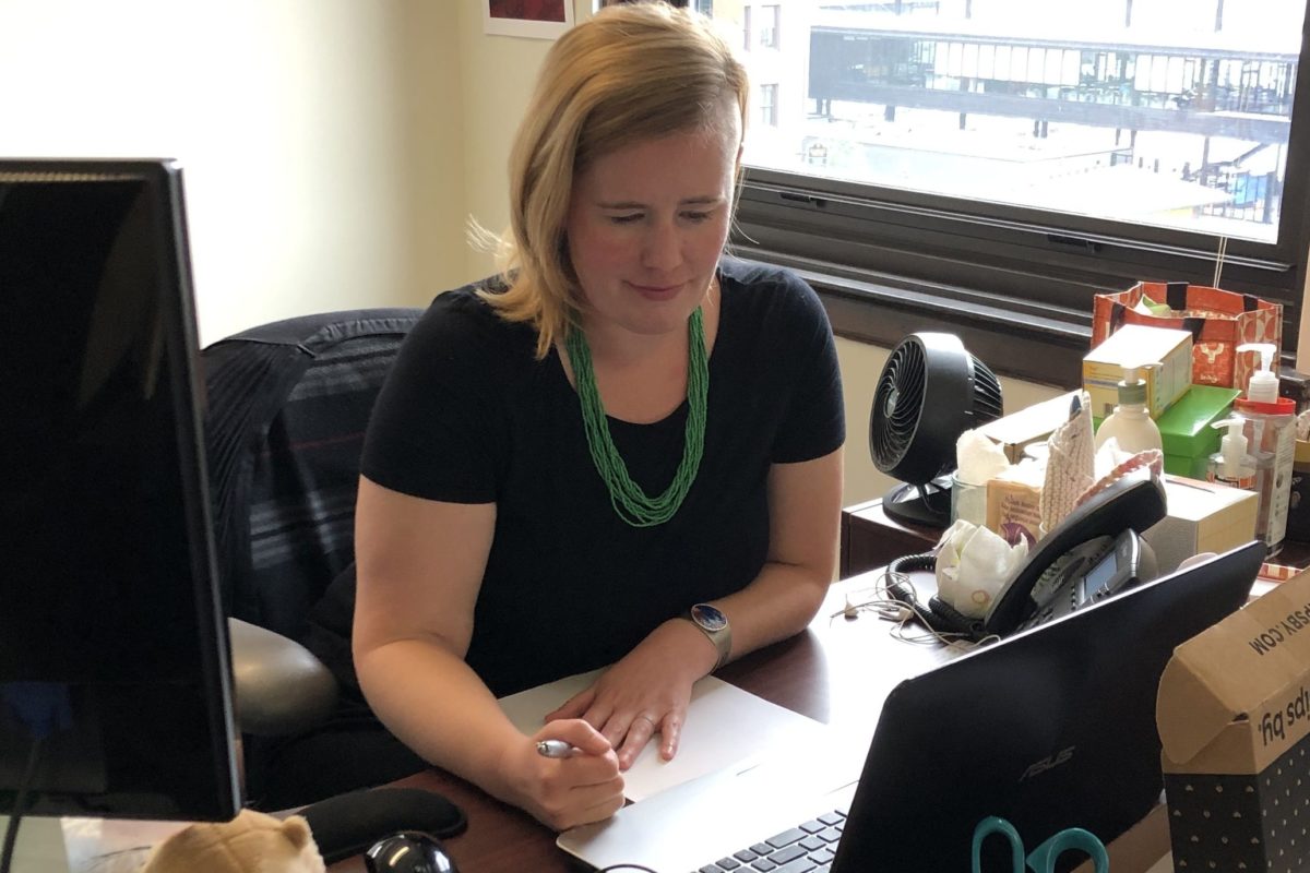 Robyn, our grants manager, at her desk